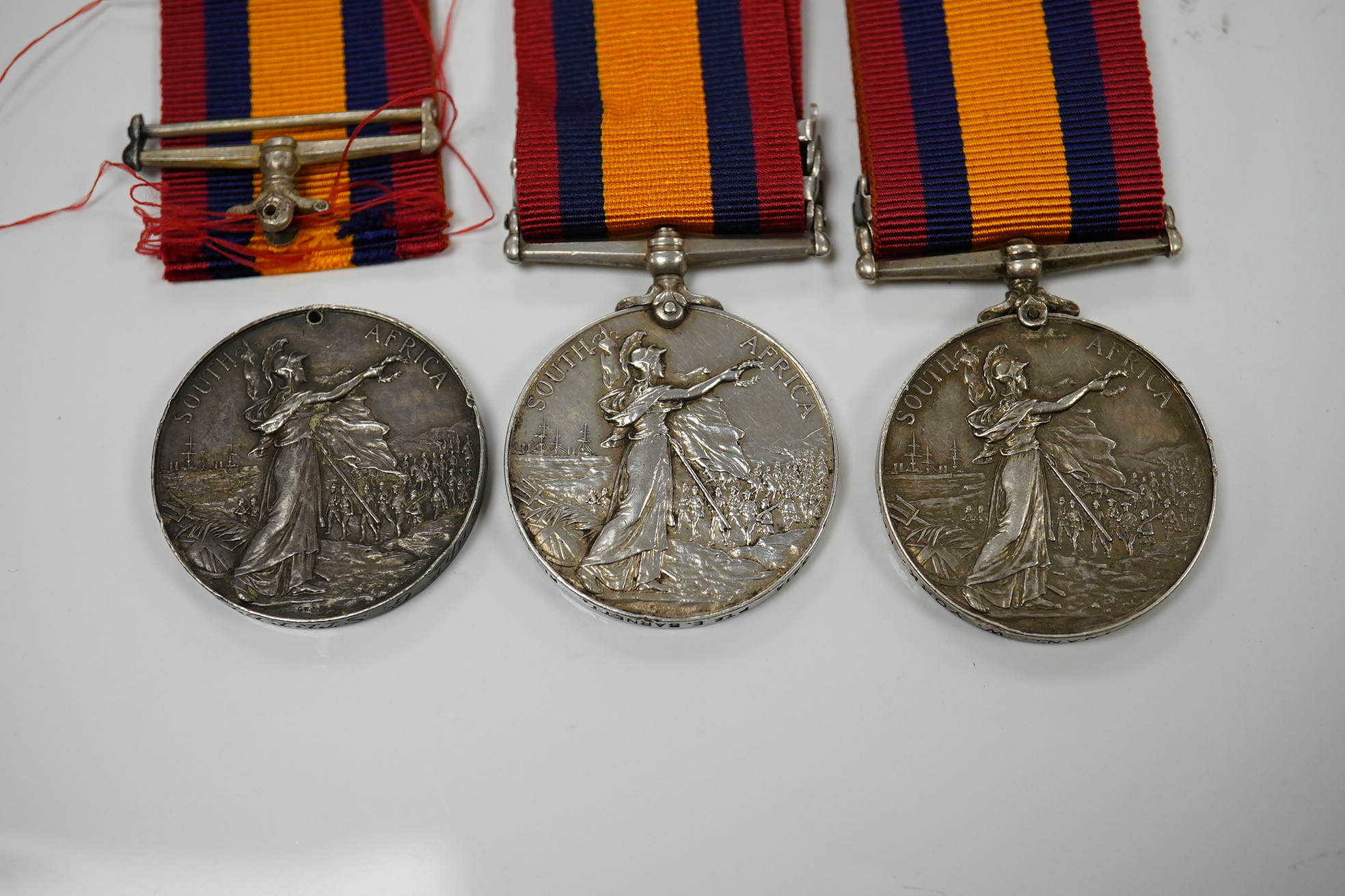 Queens South Africa Medal with CC clasp to 4493 Pte J.Finan, W.York:Regt, another with OFS and CC clasps to 3414 Pte E.Barnett, RL Fus and a third with detached disc to Sapr G Streeter, R.E.